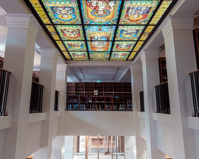 Interior of Campion College Australia's library with custom shelves by IntraSpace.
